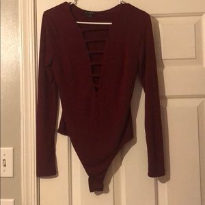 maroon body suit with cut outs